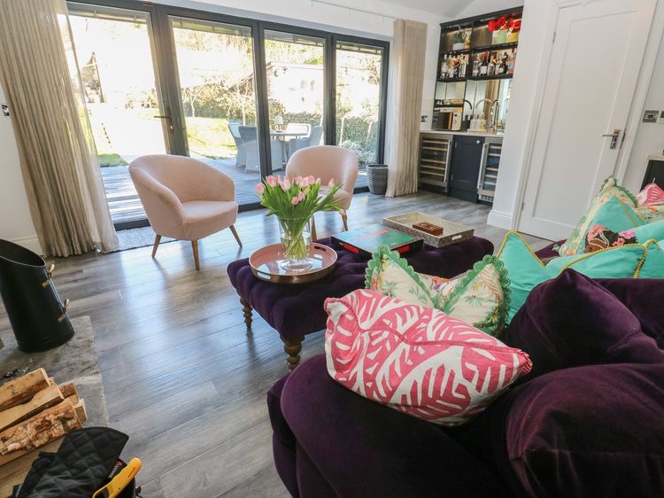 Styled lounge area looking out through the doors
